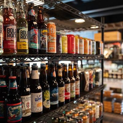 Bottles and cans on shelves.