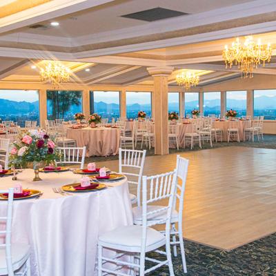 Dance floor surrounded by tables.