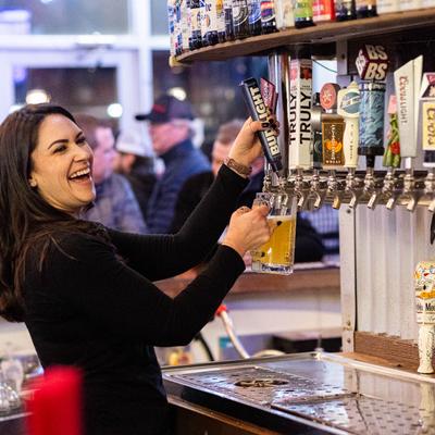 barista pouring beer
