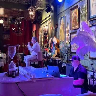 Bolero night, pianist and singer on the stage.