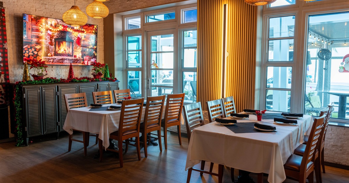 Dining space with wooden tables and chairs
