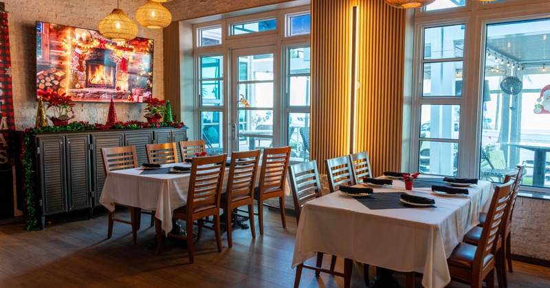 Dining space with wooden tables and chairs