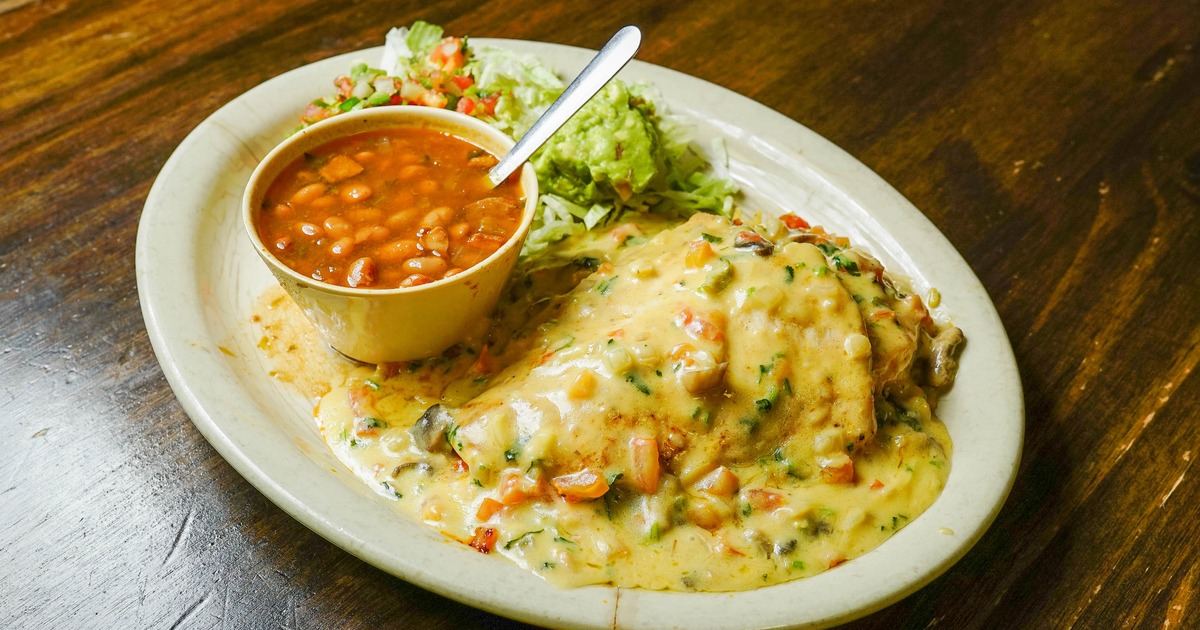 Chicken Poblano served with beans, rice and gucamole