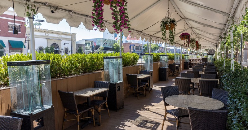 Covered patio with tables and chairs