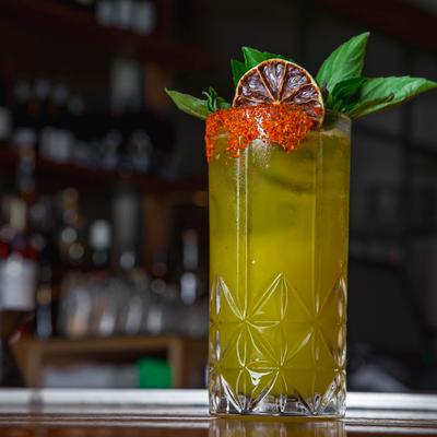 The Blossom, a vibrant green cocktail.