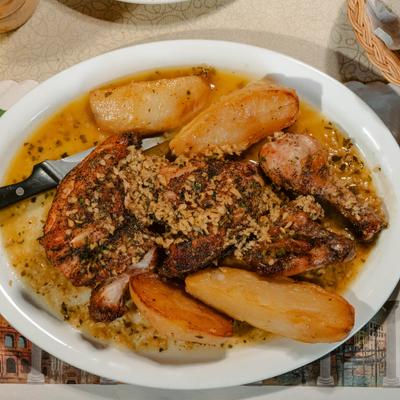 Chicken Vesuvio with potato wedges.