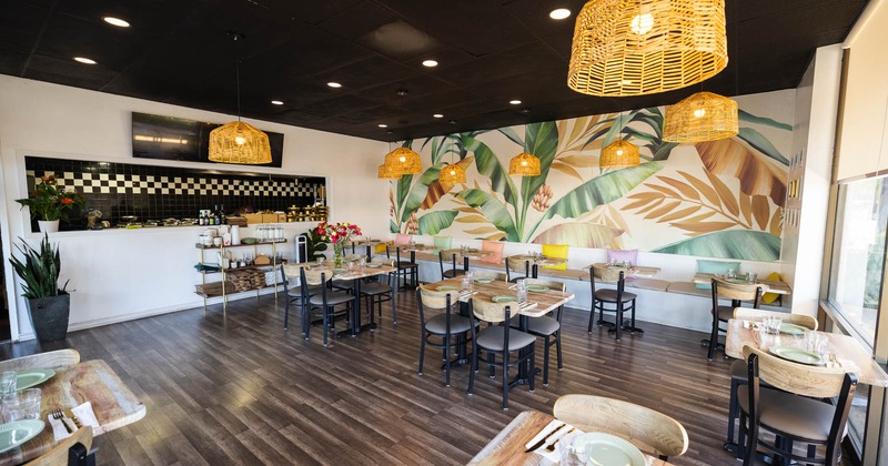 Interior of a restaurant with wooden tables and chairs