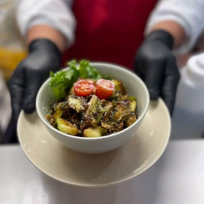 Brussels sprouts glazed in house special sauce, with fresh tomatoes and Parmesan.