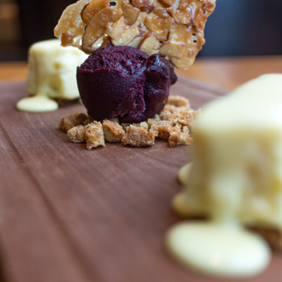 Lemon Cheesecake with cracker base, oat crumble, almond, blueberry sorbet