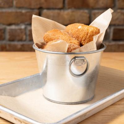 A bucket of fried dough bites.