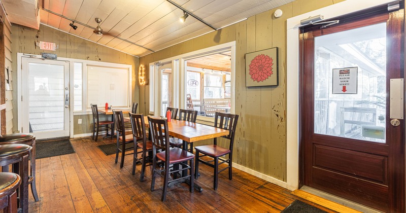 Interior, tables and chairs next to the windows