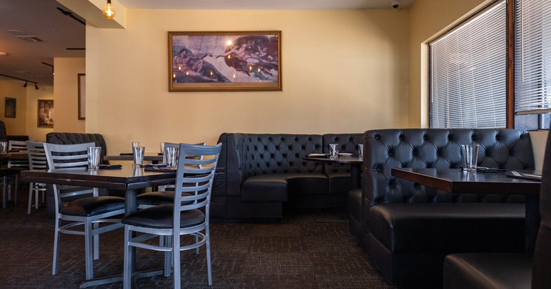 Restaurant interior, dining area with dining tables, chairs and booths