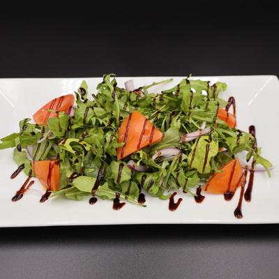 Arugula Salad, with red onions, tomatoes, balsamic vinegar, and olive oil.