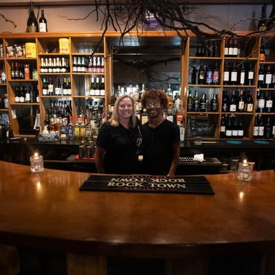 Two people behind the counter.