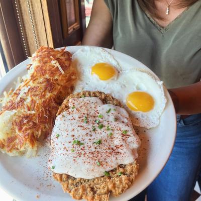 Chicken Fried Steak & Eggs with hash browns.