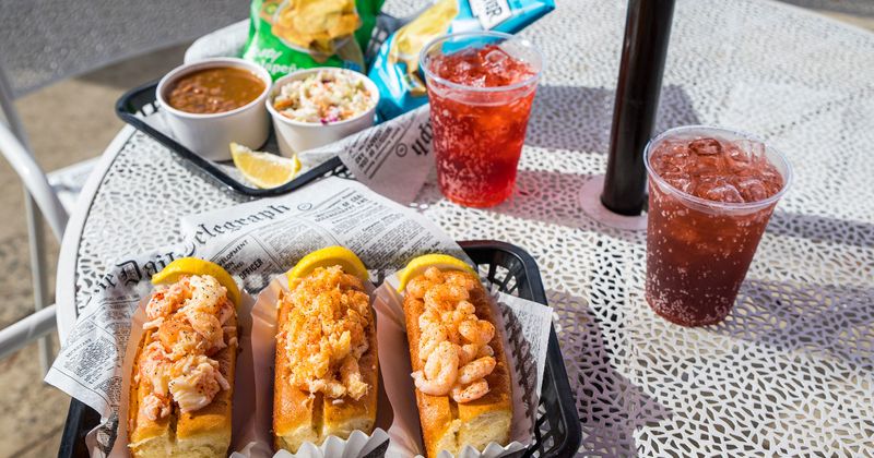 Nachos with dips, salad, seafood rolls and beer