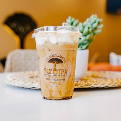 Iced Adeni Chai with cold foam served in a Socotra cup.