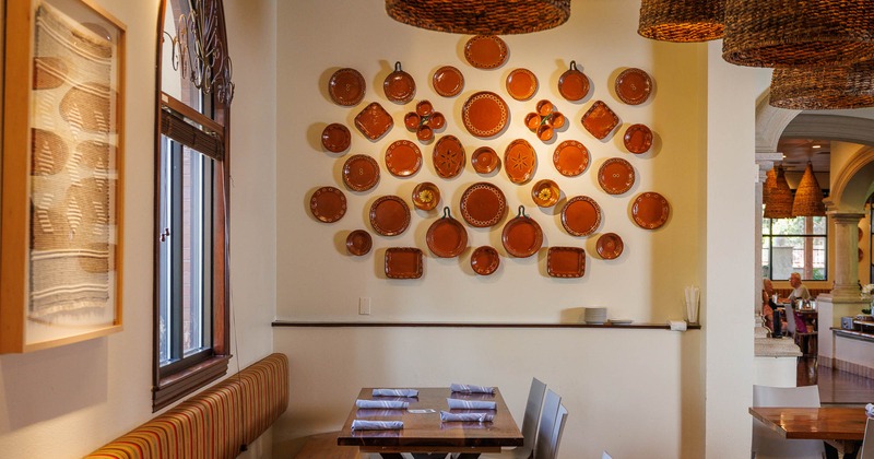 Interior, detail of dining area with decoration on the wall