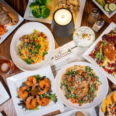 Assortment of dishes served on the table with drinks.