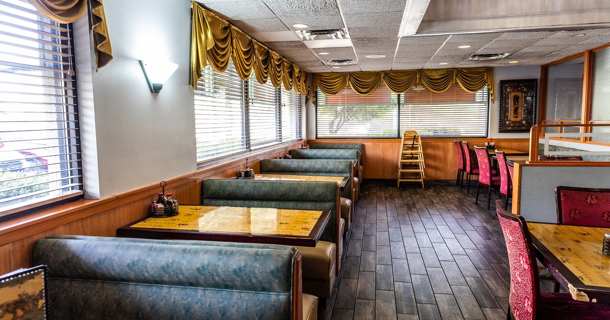 Interior dining area with dining booths lined up along windows