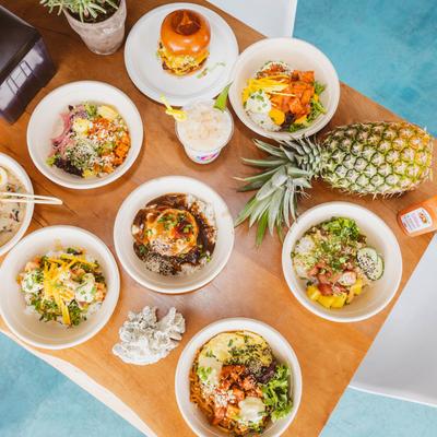 A table spread with assorted food dishes, overhead view.