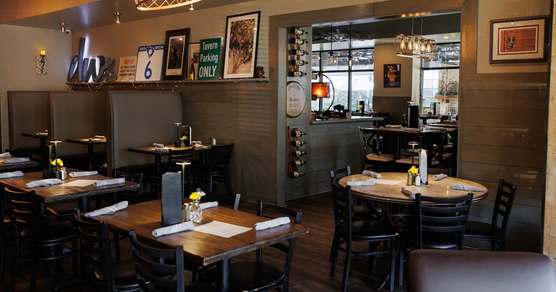 Modern and cozy interior dining area with set tables