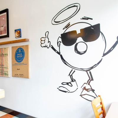 Interior, graffiti, burlap decorations and pictures on the wall