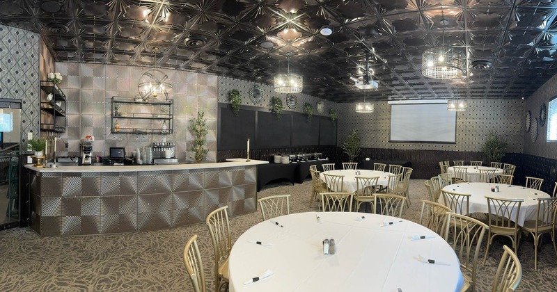 Interior, dining and banquette area, round tables for eight, bar, carpet flooring