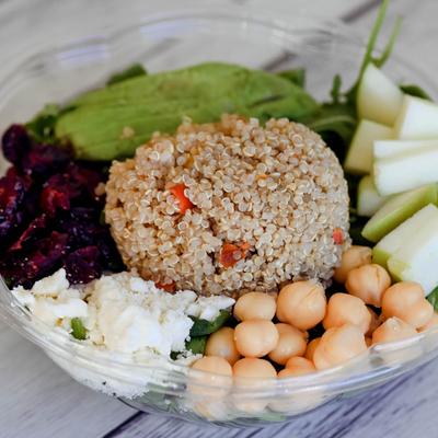 Quinoa with arugula, spinach, green apples, dried craisins, feta, chickpeas, and avocado.