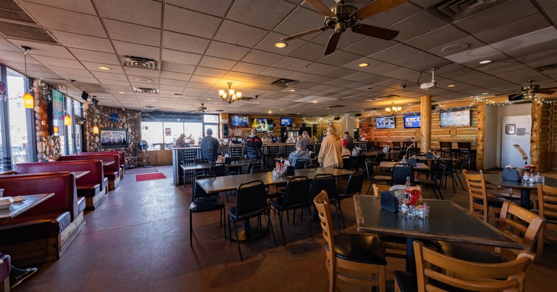 Interior, wide view, tables and chairs ready for guests