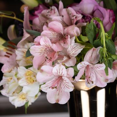 Interior, a floral arrangement composed of pink lily flowers.