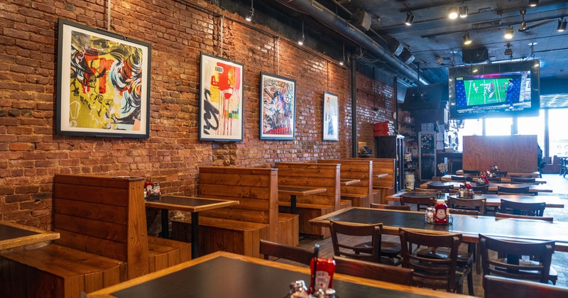 Interior, seating area with booths, tables and chairs