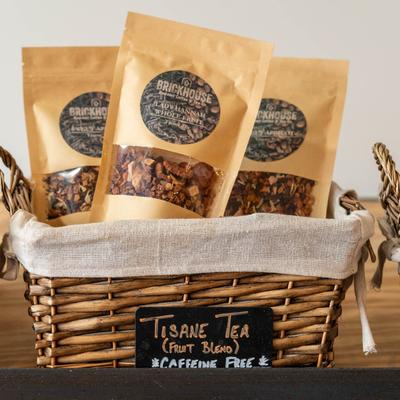 Three packages of fruit tea blends.