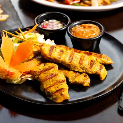 Chicken Satay served with peanut sauce and cucumber relish.