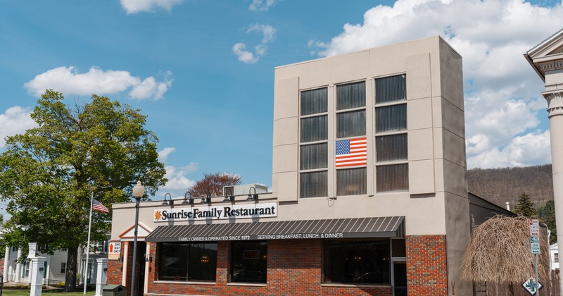 Exterior, front view to restaurant, entrance, sign above