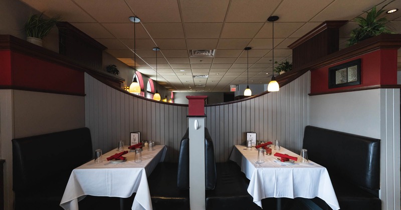 Interior, dining booths with set tables
