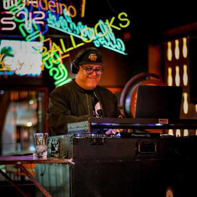 Interior, a DJ mixing music.