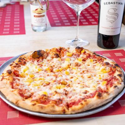 Cheese pizza with pineapple.