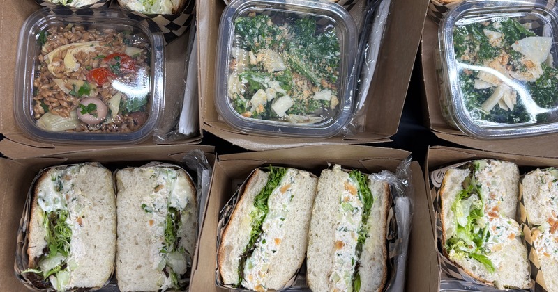 Boxed sandwiches with assorted salads