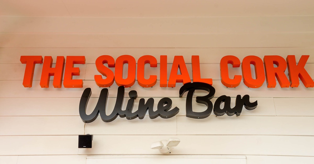 Exterior, the bar's name sign above the entrance