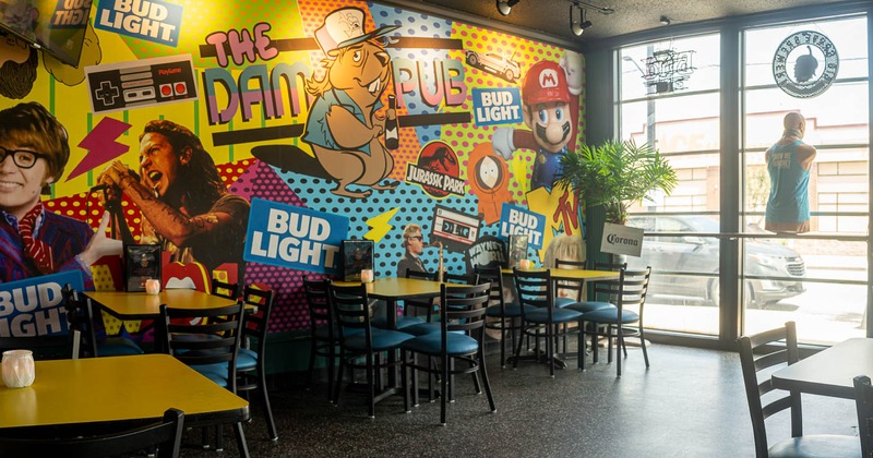 Interior, seating area near window with colorful wall in the back