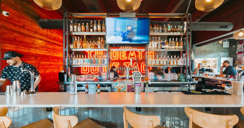 Bar, chairs, drink rack, tv above