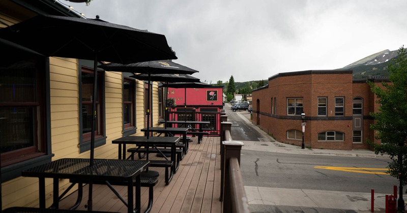 Exterior, tables with parasols and benches