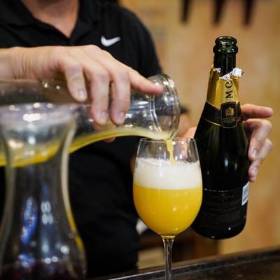 A person pouring a drink