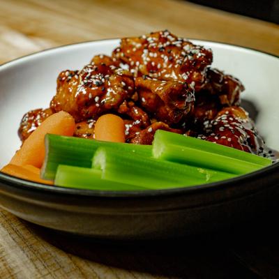 Asian wings with side celery and carrots.