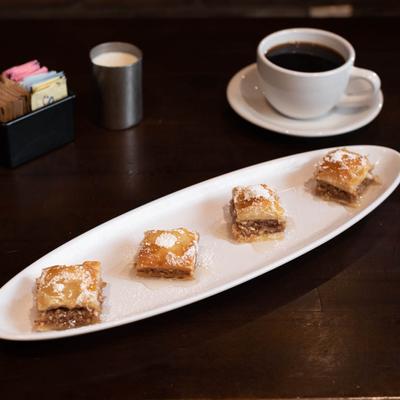 Baklava plate with a cup of coffee.