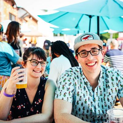 Two people hanging out in the biergarten.