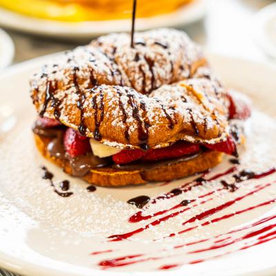 Croissant French Toast filled with Nutella, strawberries and bananas.