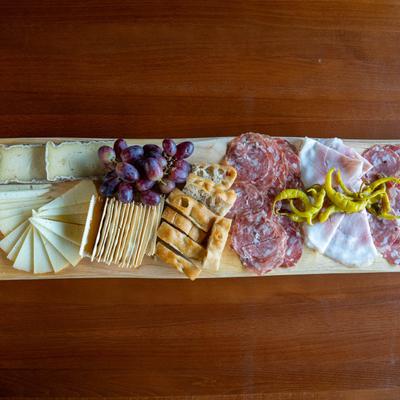 Large Roy board with cured meats and cheese, grapes, house-made bread and crackers.