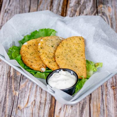 Deep fried mozzarella served with basil aioli sauce for dipping.